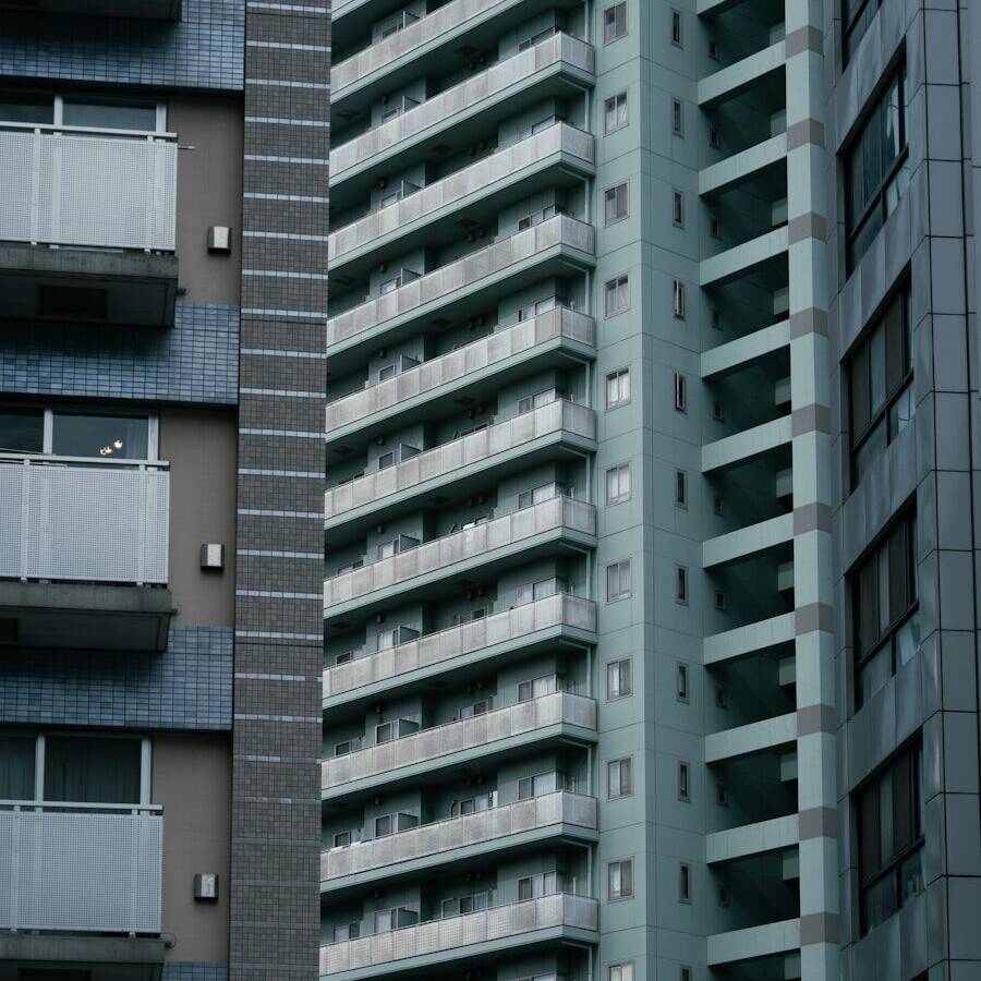 A couple of tall buildings next to each other