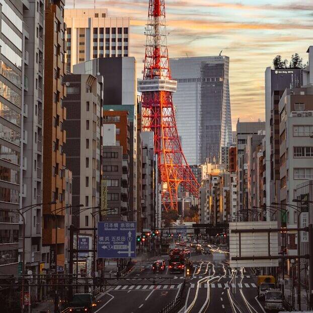 A view of a city street with a tower in the background